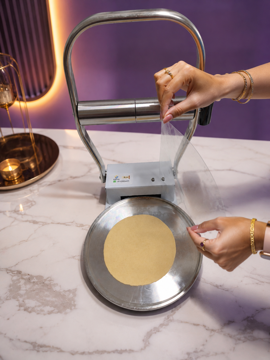 Pressed roti lifted along with the plastic sheet.